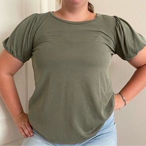 Olive green shirt with elastic sleeves for a light puff look.